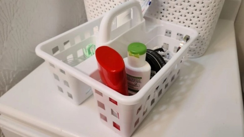 Multiple colored craft caddies sitting on a shelf