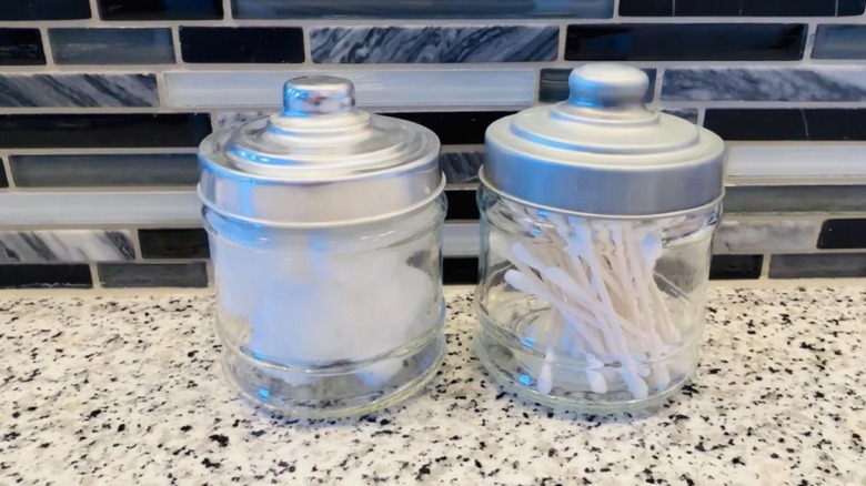 Two jars filled with Q-tips and cotton swabs