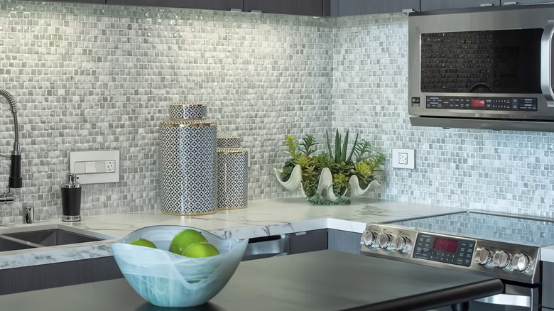 Kitchen with busy-looking glass mosaic tile backsplash