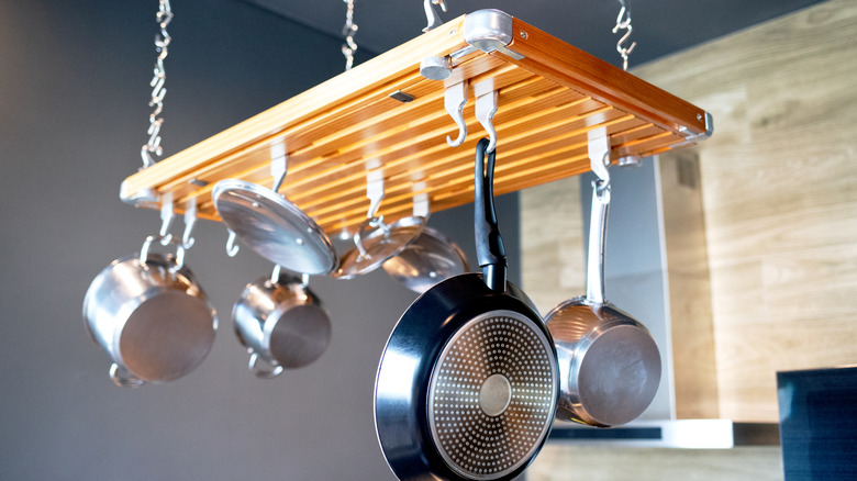 Modern kitchen pot rack hanging above a countertop