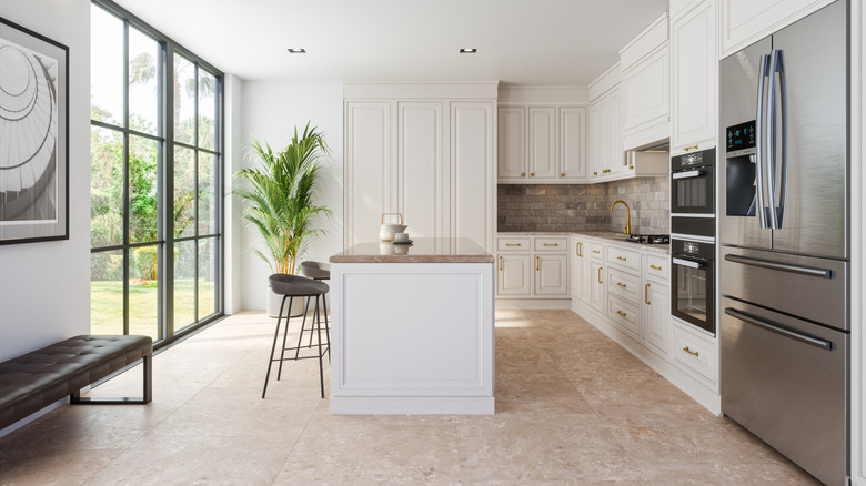 A modern kitchen with a bland all white color scheme