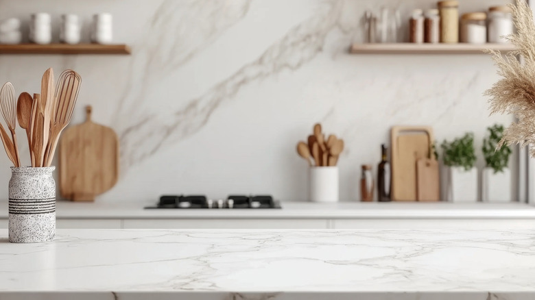 Close up of a kitchen island with a marble countertop