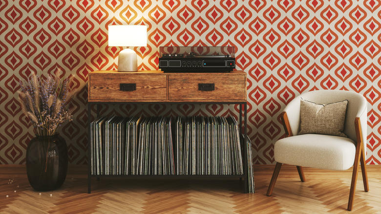Vintage record player and lamp with colorful geometric wallpaper