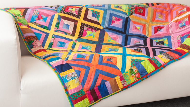 Colorful patchwork quilt on a white couch