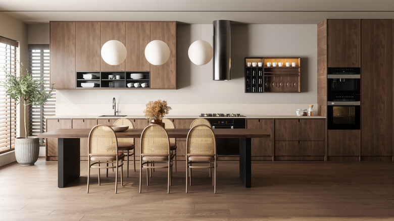 Kitchen with wood cabinets, floor, and table.