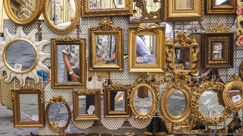 Vintage mirrors hung up at a flea market