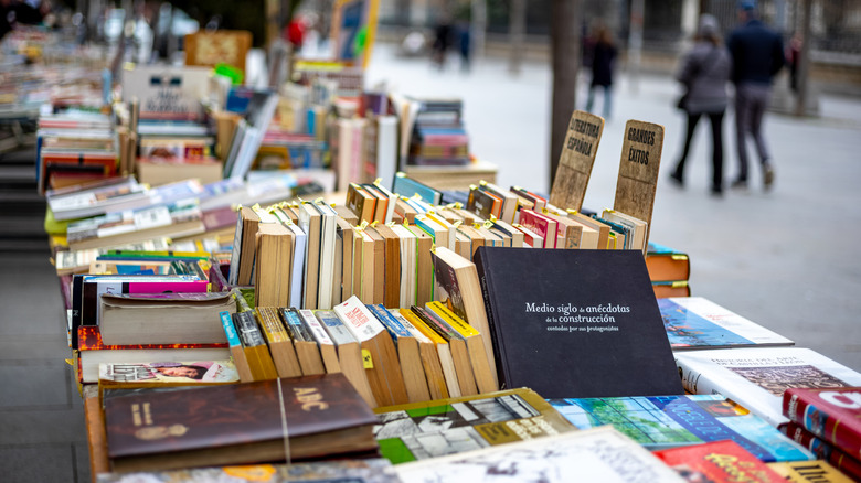 A table of books at a flea market