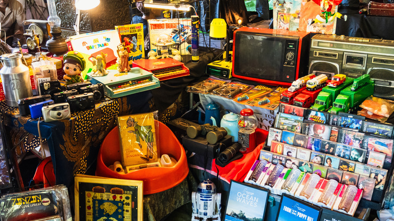 A collection of vintage toys in a flea market