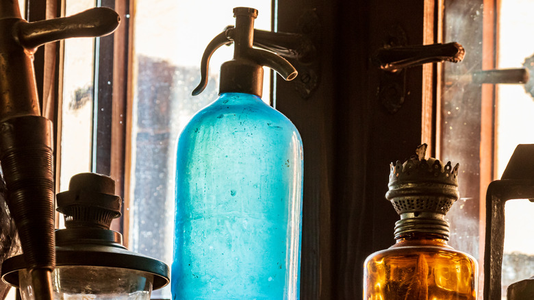 Vintage photo of person with siphon seltzer bottle