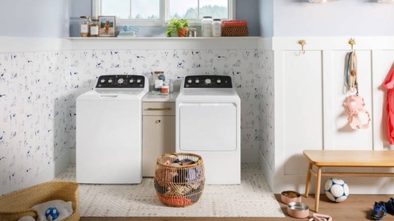 A white washer and dryer in a pretty laundry space