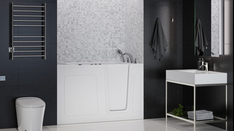 A small white tub in a modern bathroom