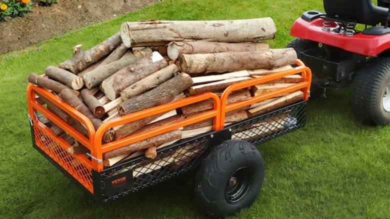 A garden cart filled with chopped wood