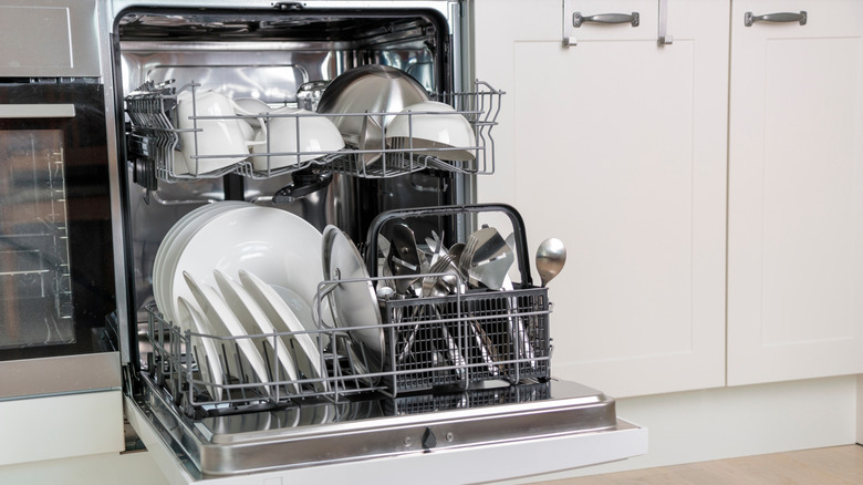 Dishwasher full of clean dishes and silverware