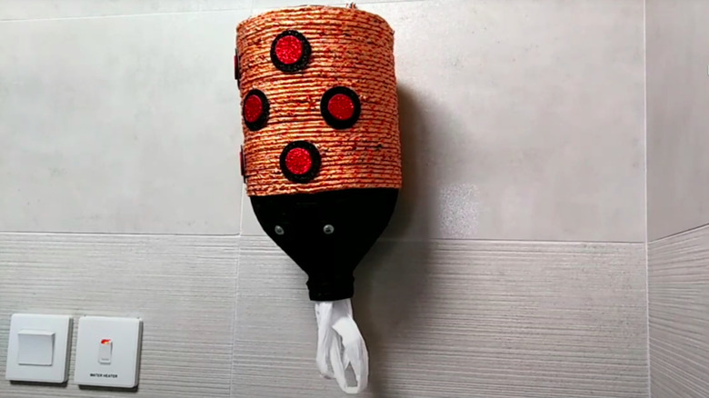 Creature-style bag dispenser made from plastic bottle