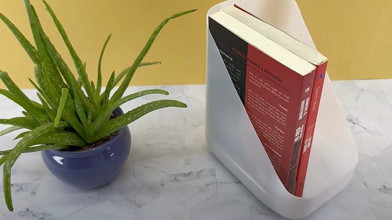 Homemade book holder crafted from milk bottle