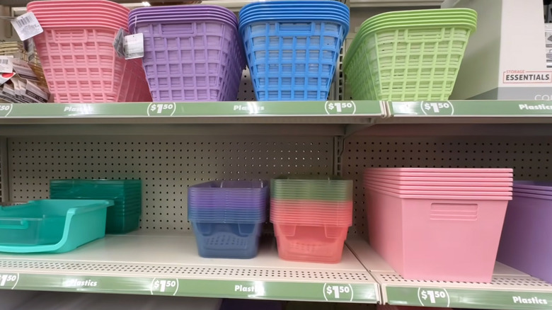Pastel plastic bins stacked on the shelves at Dollar Tree