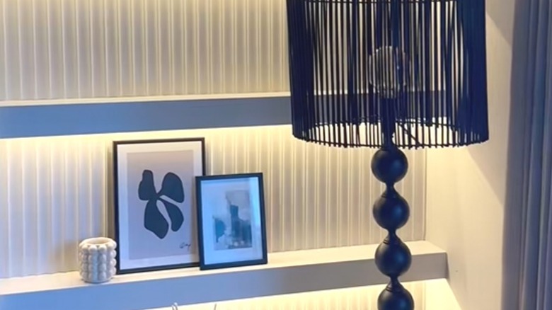 Modern IKEA MOSSLANDA shelves with white paneling and elegant decor