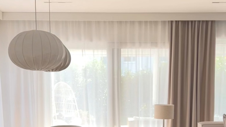 Modern living room with white DIY curtain valence from IKEA shelf