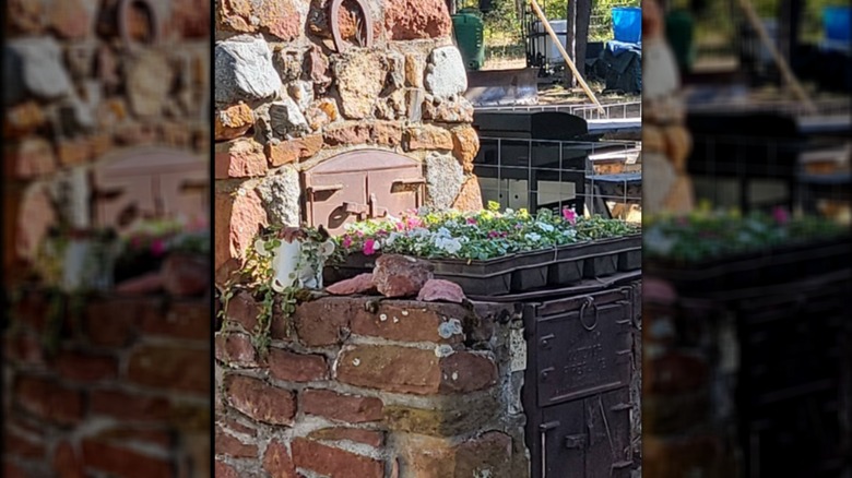 Vintage bread loaf pans transformed into flower planters.