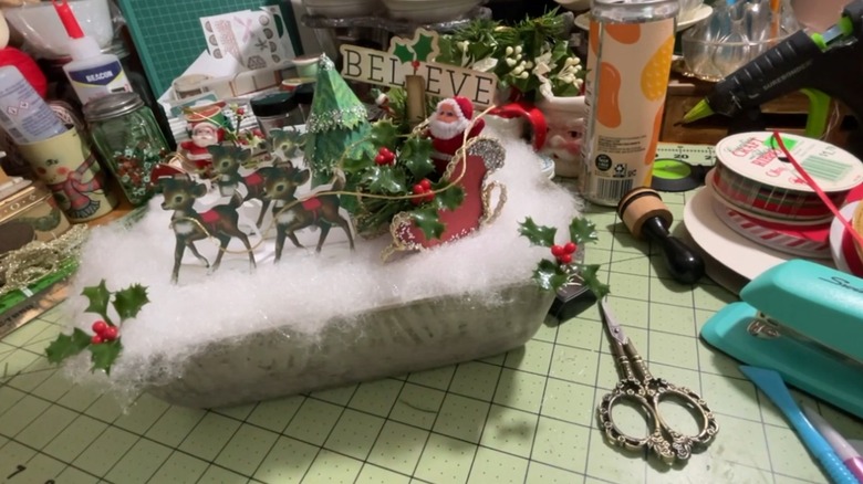 Santa and his reindeer adorn an upcycled bread loaf pan.