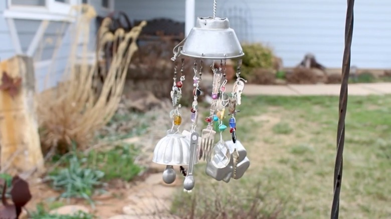 A windchime made from  knickknacks from a junk drawer