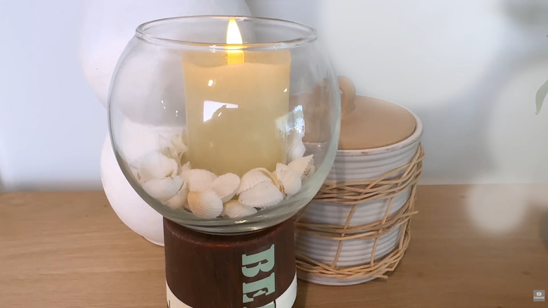 Electronic candles and seashells in DIY glass candle holder