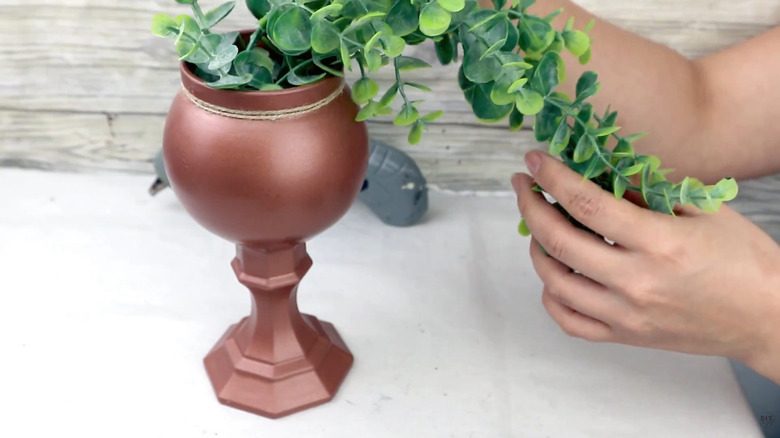 Copper painted goblet made from dollar store fishbowl and candle stand