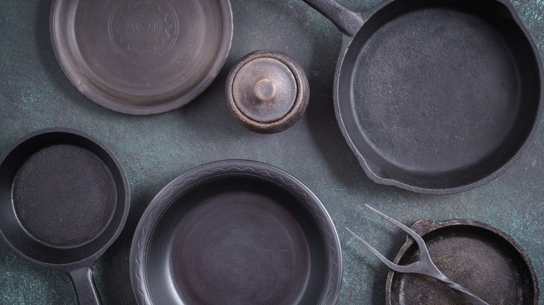 Collection of cast iron cookware and utensils