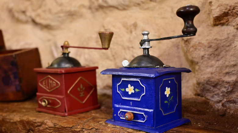 Blue and red antique coffee mills