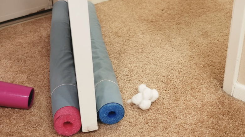 Door draft stopper made using pool noodles
