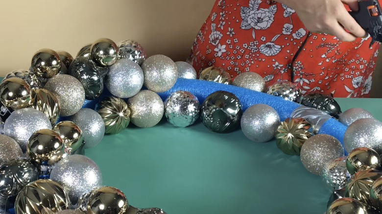 Christmas wreath out of pool noodle and baubles