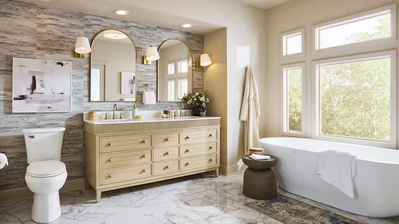 A beautiful neutral bathroom has been designed with Home Depot owned brand products