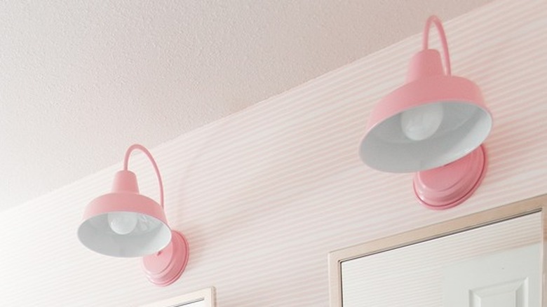 A bathroom with pink lighting