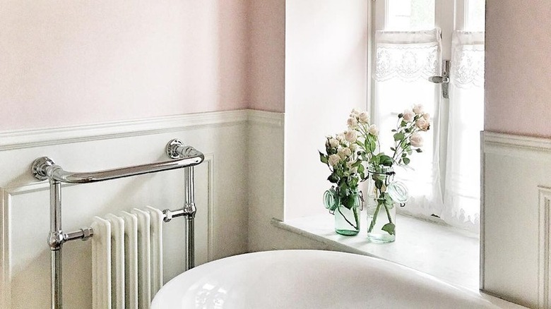 A pink bathroom in French country styling