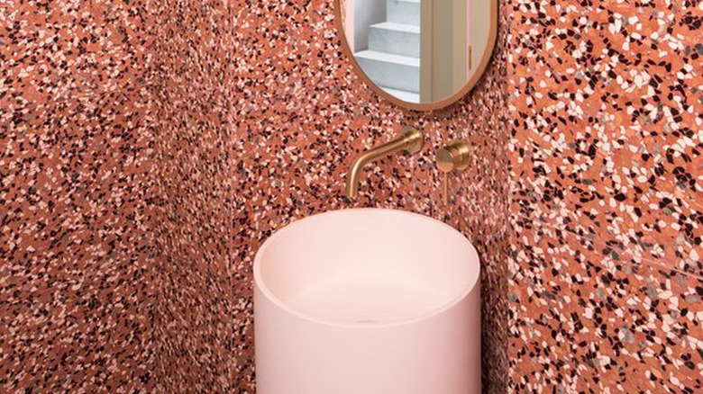 pink bathroom with terrazzo walls