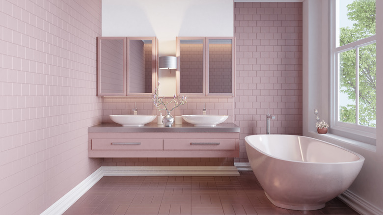 pink bathroom with pink subway tiles on the walls