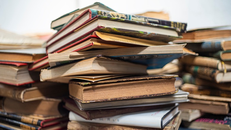 Old books are piled on the ground