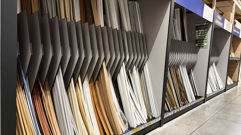 Decorative molding is neatly arranged in a big box store aisle