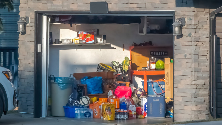 A disorganized garage is full of random items