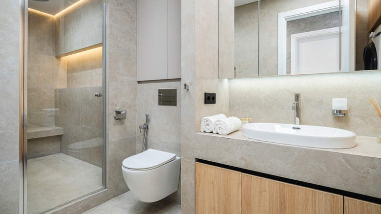 Neutral bathroom with modern fixtures.