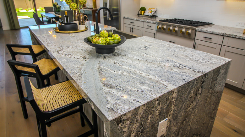 Stone kitchen island with bar stool from above