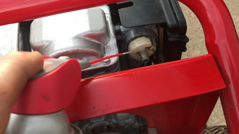 Cleaning a small engine carburetor with WD-40