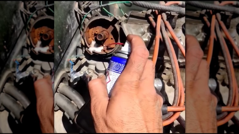 Spraying an engine's electrical contacts with WD-40