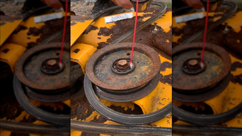 Spraying lubricant on a seized spindle pulley