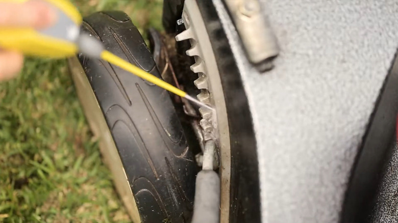 Lubricating mower wheel height adjuster with WD-40