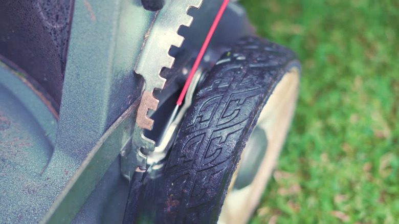 Lubricating a mower's height adjuster with WD-40