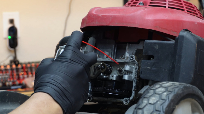 Fixing a mower's stuck valve with WD-40