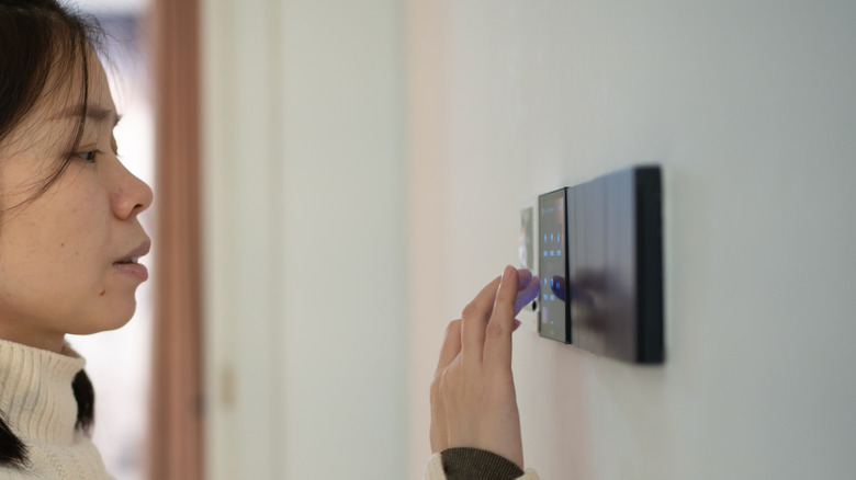 Woman using a smart home switch