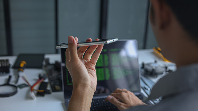 Man talking to a voice assistant in a workshop