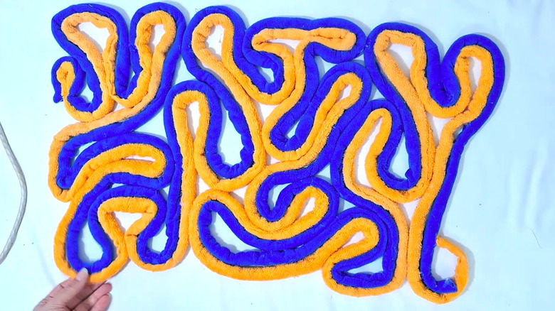 Making abstract mats from strips of old towels